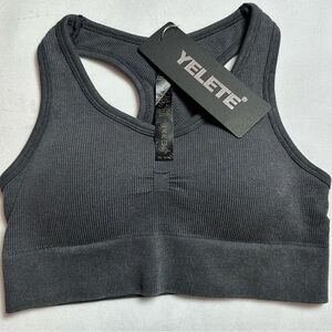 YELETE dark charcoal grey sports bra. NWT Size Small